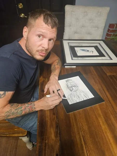 Zechariah drawing at the table